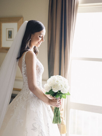 Bride in wedding dress with bouquets at Hydro Majestic Hotel