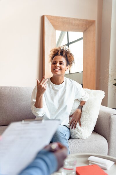 woman speaking in therapy session