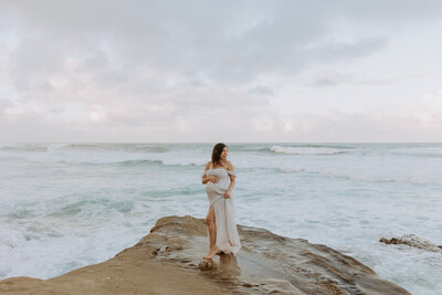 Natural Candid Documentary Family Maternity Baby Pregnancy Announcement Photo shoot at La Jolla Windansea beach at sunset - Couples Mom and Dad San Diego Maternity Photographer