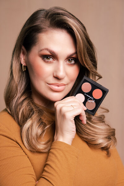 Beauty photography portrait for MAC Cosmetics showing model holding palette