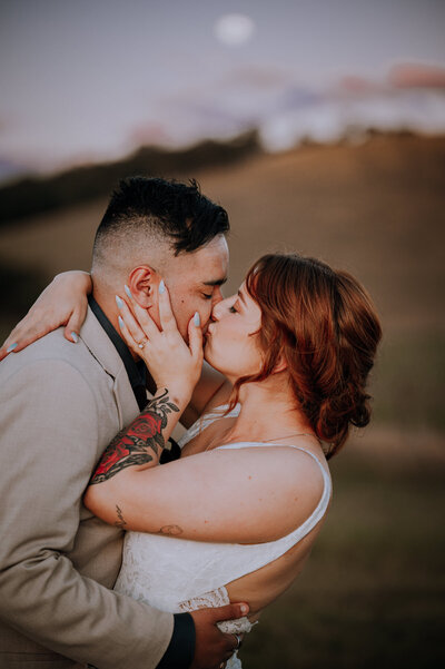 Close up of bride and groom kissing