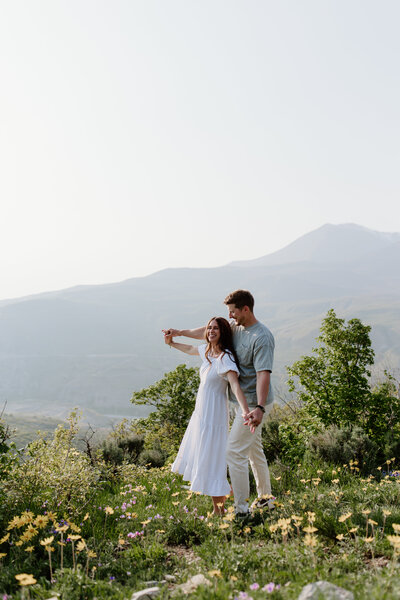 Couple in grass field engagement photography