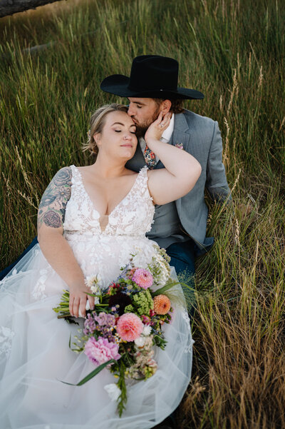 Couple laying in grass