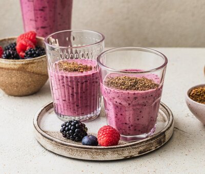 Berry glow smoothie with whey protein and flax, designed to support skin health and  hormone balance in women 40+