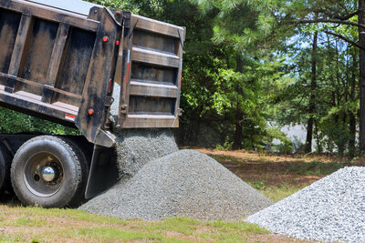 delivery-of-gravel-to-residential-area-for-landsca-2024-11-27-19-02-53-utc