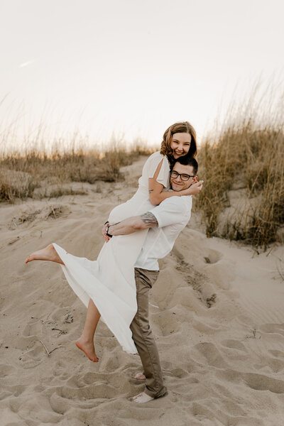 couple laughing on the beach