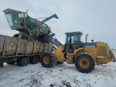 an old combine being cleaned up by metalnecks