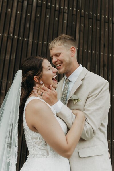 bride and groom laughing