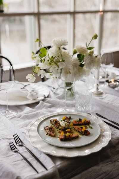Wedding reception food with table flowers