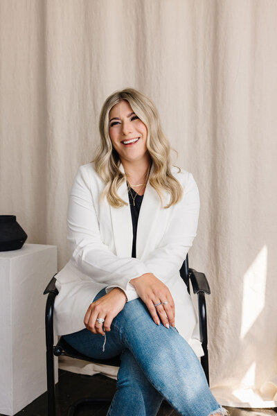 Calgary Realtor Leigh Kormos in white coat