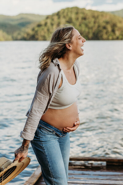 Indianapolis Mother Maternity session, cradles bump on a sunning evening on the lake