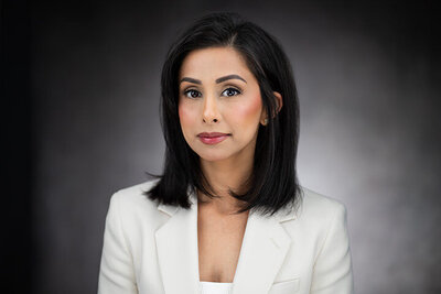 Executive headshot of CEO in dark suit, captured in NJ studio by Alex Kaplan Photography.
