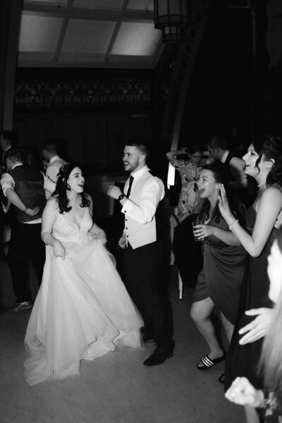 Bride and groom enjoying dancefloor with guests