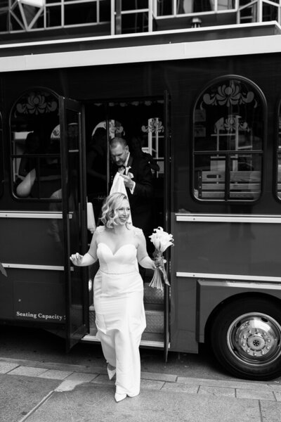 high end photo of bride and groom exiting Molly's Trolley in downtown Pittsburgh, PA 
