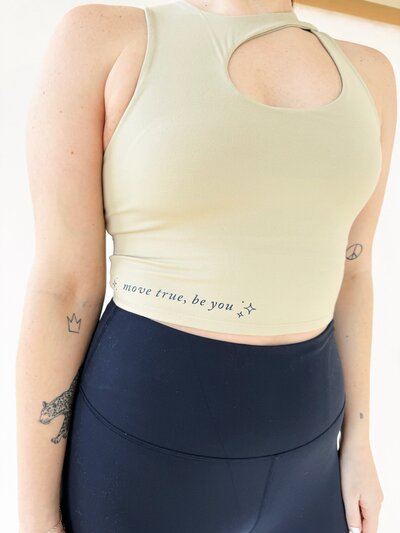 up close of oat workout top with move true be you on it