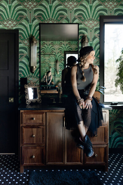 Angie sitting on top of a dresser