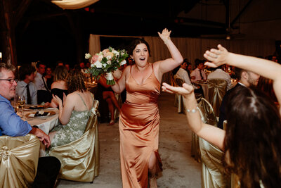 bridesmaid-making-her-entrance-at-chateau-montebello