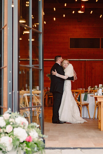 Bride and groom just married looking happy holding hands