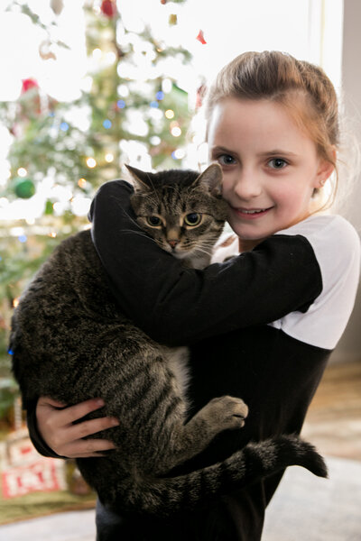 Kid holding a cat | Family Session