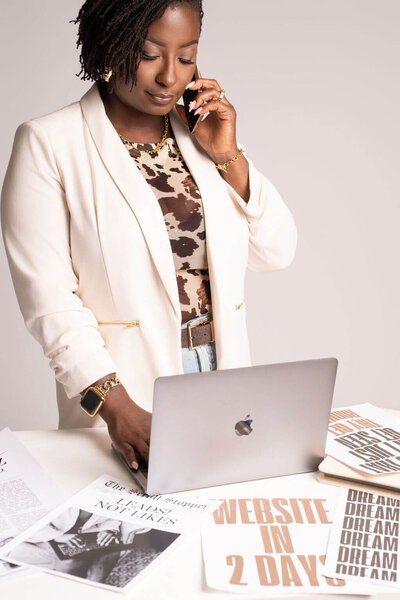 Web designer Shanika customizing Showit website layout for real estate brand.