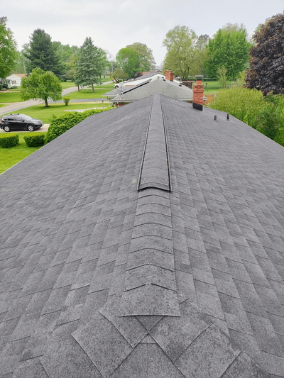 Long view of a freshly shingled roof installed by Black Bear Roofing & Exteriors.