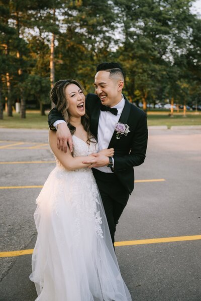 Bride and groom laughing together