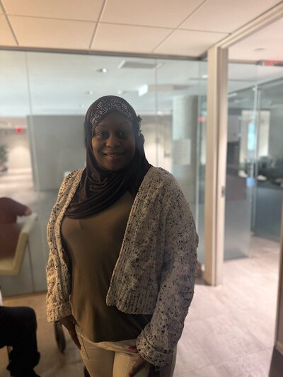 woman in scarf smiling at camera