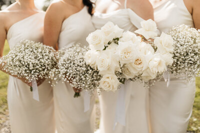 three coordinators standing side by side at a wedding