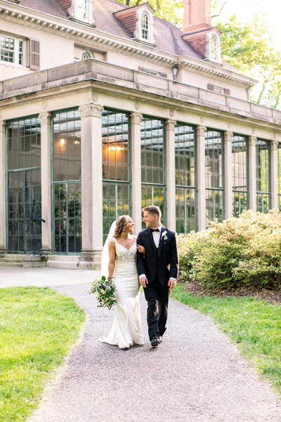 Couple posing for wedding portraits at Winterthur Museum and Gardens