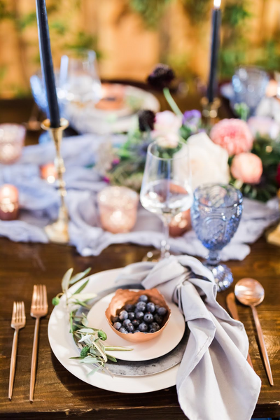 Classy table setting at barn wedding venue