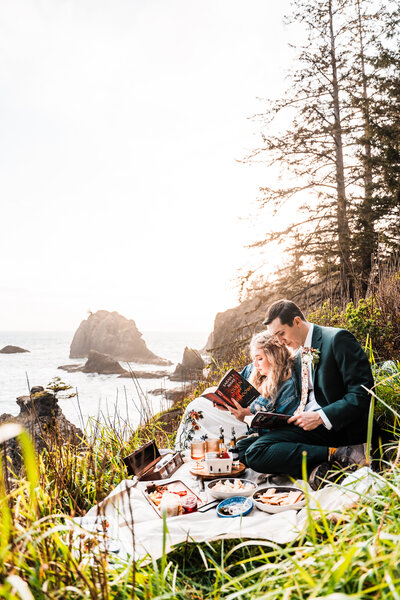 couple kissing on a cliff overlooking the ocean