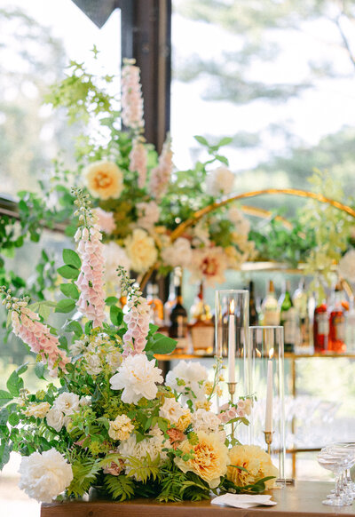 Bright flower arrangements decorate the bar at La Toundra for a wedding reception. 