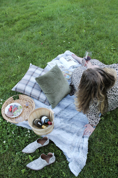 Life coach and author Ashleigh Henry in a dramatic black and brown dress — visually expressing what it means to live a deeply inhabited, harmonious life and anchored, checked ambition.