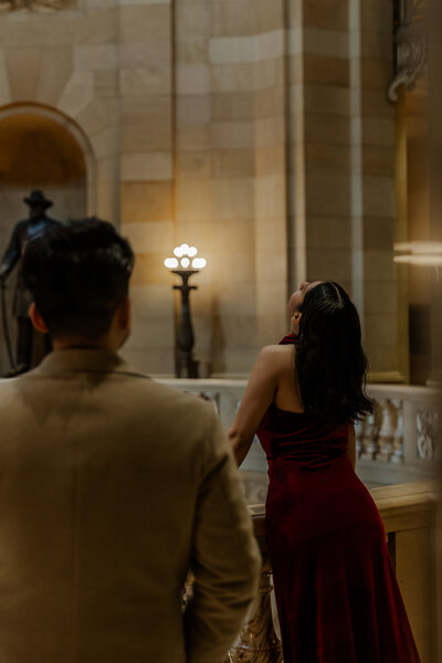 Indoor Couples Photoshoot at the Minnesota State Capitol of One partner admiring the other