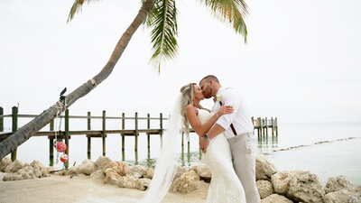 Couple Kisses On their wedding day in Key West Florida