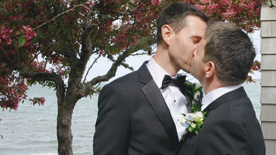 Bride and groom kissing during first dance