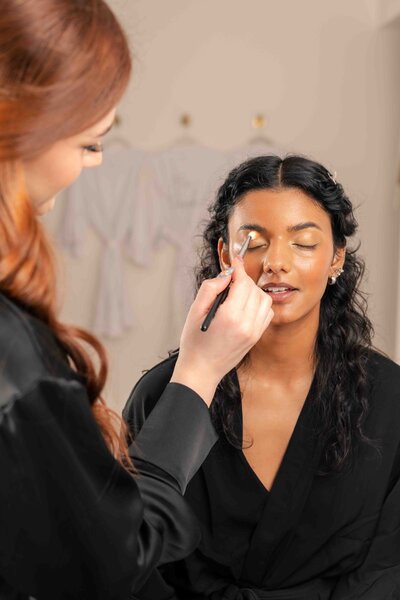 women getting makeup done