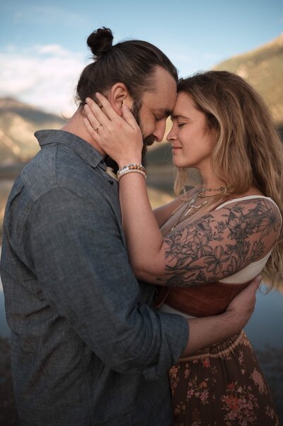 Couple renewing their vows at a scenic overlook in Colorado, captured by elopement photographer Kristen Vann
