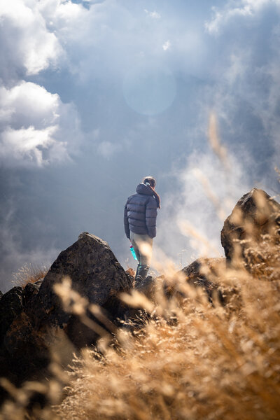 A female hiker enjoying the view in Nepal.