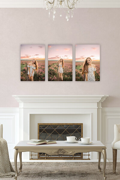 white mantel with images above it on white wall