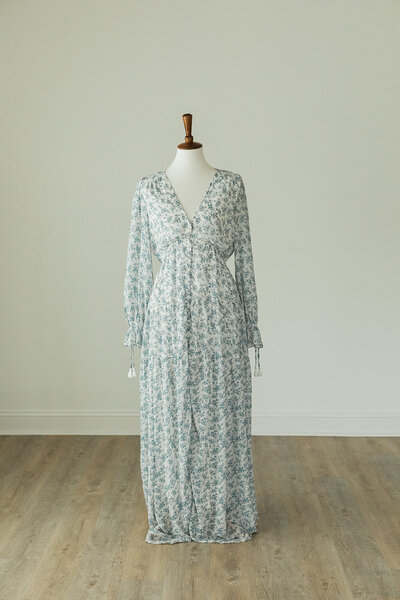 white and blue floral dress with buttons to reveal pregnant bump