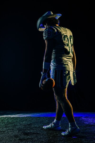 Senior Football Player Wearing Cowboy Hat