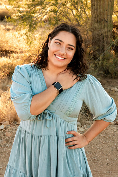 Closeup of photography business owner smiling in blue blouse