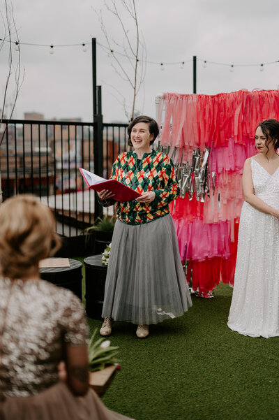 A celebrant performs a wedding ceremony on the roof top in London. 