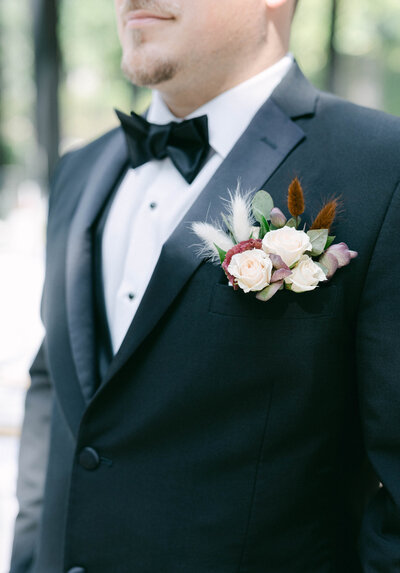 close up of grooms floral boutonniere  knoxville tennessee wedding photographer