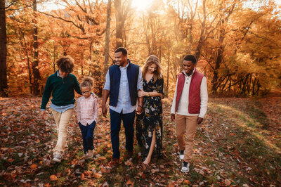 Family walks together along the Blue Ridge Parkway for their Fall Family Photos in Asheville.
