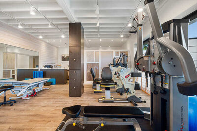 Physical therapy gym with resistance bands and exercise machines