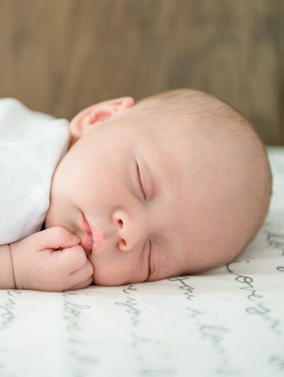 newborn baby boy sleeping in crib by lancaster pa photographer