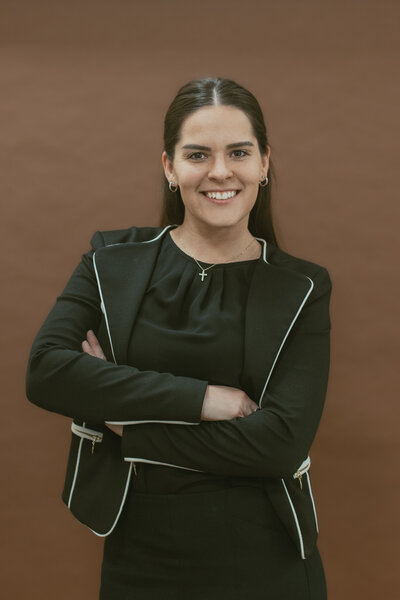 woman smiling with her arms crossed