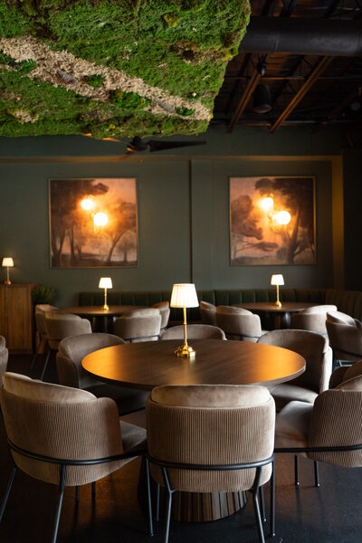 Refined table setting with soft lighting and natural textures inside Revé